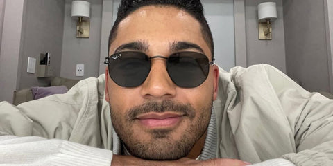 Actor Michael Evans Behling was seen wearing black Ray-Ban Hexagonal RB 3548N 002/58 Polarised sunglasses in his Instagram post, October 2022.