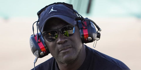NBA legend Michael Jordan was seen wearing black Oakley Frogskins Lite OO9374 49 Prizm Polarised half-rim sunglasses at the 2024 NASCAR Cup Series Championships
