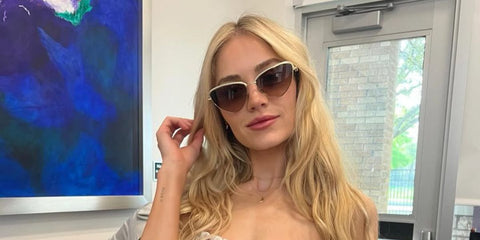 Actress Michelle Randolph was seen wearing gold bejewelled Tiffany & Co TF3107KB 6212/3B Gold Plated cat eye sunglasses on the set of Landman season 2.
