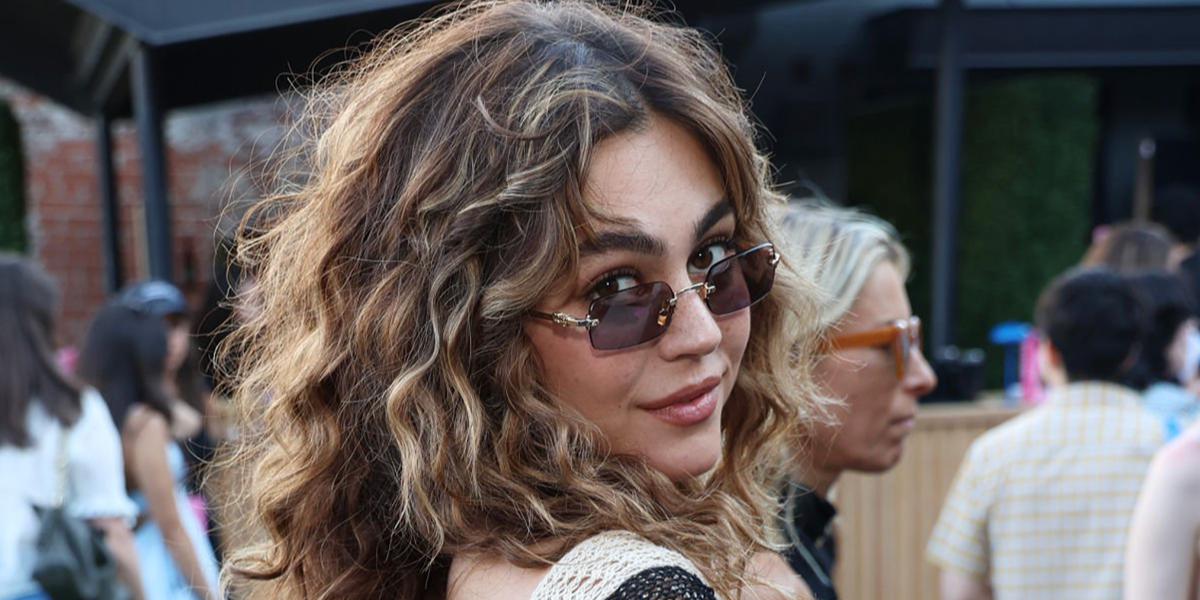 Off Campus star Mika Abdalla was seen wearing gold Miu Miu MU B50S 5AK20I rimless sunglasses with purple brown lenses at the Prime Video's Obsessed Fest Pre-Reception in Los Angeles, June 2026