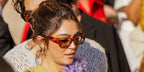Off Campus star Mika Abdalla ore tortoise Valentino VG0072S 001 sunglasses with light green lenses at the Valentino Spring Summer 2027 show during Paris Fashion Week.