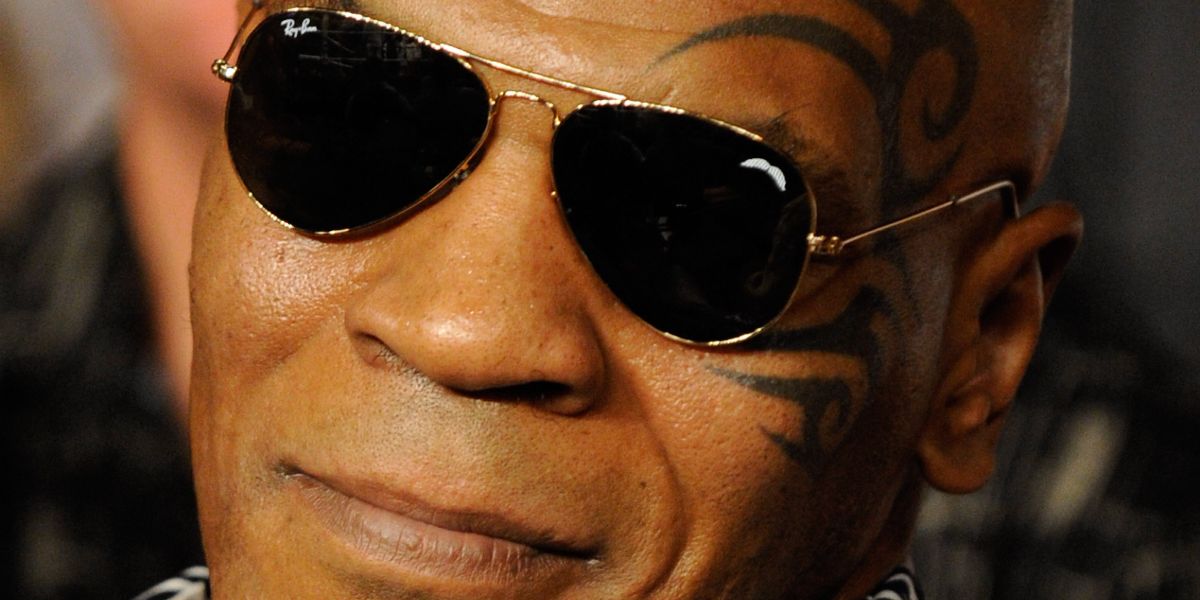 Mike Tyson was seen wearing gold Ray-Ban Aviator II RB 3026 L2846 sunglasses