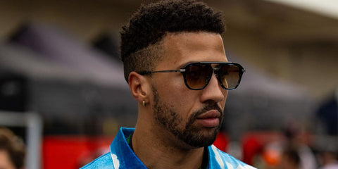 Fending champion and best friend of Lewis Hamilton, Miles Chamley-Watson was seen wearing black and white gold Dita Terracraft DTS 416 01 aviator sunglasses with grey lenses at the F1 Grand Prix of United States in Austin, Texas