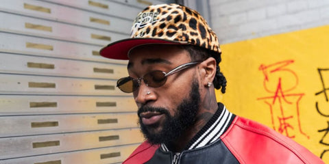 American football player Miles Sanders of Dallas Cowboys was seen wearing ruthenium Bottega Veneta Sardine BV1386S 002 oval sunglasses with yellow lenses in his Instagram post, February 2026.