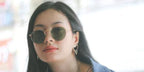 Thai actress Milk Pansa Vosbein was seen wearing gold Ray-Ban Round Metal RB 3447N 001 sunglasses