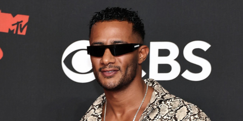 Egyptian singer Mohamed Ramadan was seen wearing black Balenciaga BB0041S 001 wraparound sunglasses at the MTV Video Music Awards 2025. Shop online now on Pretavoir