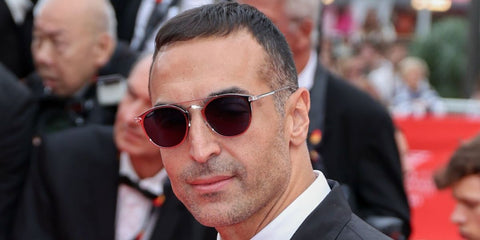 Saudi film producer Mohammed Al Turki was seen wearing ruthenium Cartier CT0015S 006 sunglasses at the 2025 Cannes Film Festival. Shop online now on Pretavoir