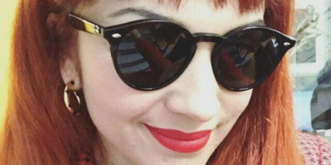 Chilean singer Mon Laferte was seen wearing black Ray-Ban RB 2180 601/71  round sunglasses in a social media post.