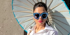 Mona Patel also known as Haute Mona was seen wearing crystal-studded Gucci GG0116S 009 blue sunglasses in Rome, shared through Instagram