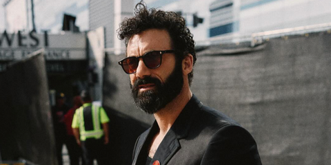 Actor Morgan Spector was seen wearing black Garrett Leight Ace Sun 2081 BK/SFPRW sunglasses with red lenses at the Emmy Awards 2024.