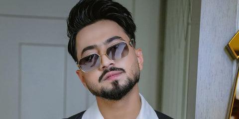 Indian content creator Faisal Shaikh, widely known as Mr. Faisu, was seen wearing gold Prada PR A51S ZVN50C sunglasses with brown gradient lenses in his Instagram post, June 2025. Shop online now on Pretavoir