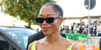 Naomi Ackie was seen wearing black Prada PR B11S 16K731 sunglasses at the Prada Spring/Summer 2027 fashion show during Milan Fashion Week.