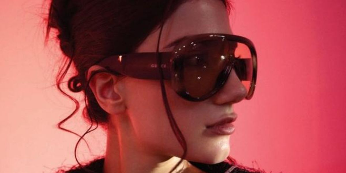 Dubai-based YouTuber Narin Ammara was seen wearing striped havana Gucci GG2164S 004 sunglasses in a Woman magazine United Arab Emirates feature, March 2026.