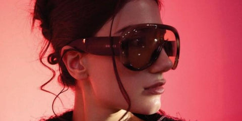 Dubai-based YouTuber Narin Ammara was seen wearing striped havana Gucci GG2164S 004 sunglasses in a Woman magazine United Arab Emirates feature, March 2026.