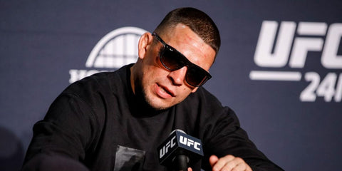 Mixed martial artist Nate Diaz was seen wearing black and brown Ray-Ban Boyfriend RB 4147 6095/85 sunglasses with brown gradient lenses in a UFC press conference. Shop online now on Pretavoir