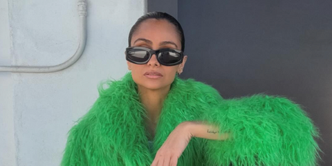 Nazanin Mandi was seen wearing black Miu Miu MU 11WS 1AB5S0 sunglasses in her Facebook post, December 2025.