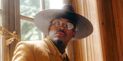 Ne-Yo was seen wearing gold Ray-Ban Oval RB 3547V 2500 optical glasses in Paris, shared through his Instagram in May 2026.
