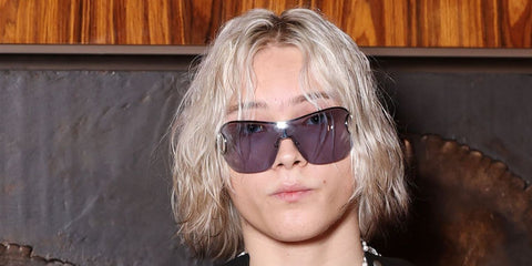 Rapper Nettspend was seen wearing Gucci GG2174S 001 shield sunglasses at the Gucci Menswear Spring/Summer 2026 fashion show during Milan Men's Fashion Week.