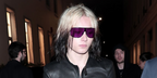 Nettspend was seen wearing purple violet Gucci GG2276S 005 shield sunglasses at the Gucci Fall/Winter 2026 fashion show during Milan Fashion Week.