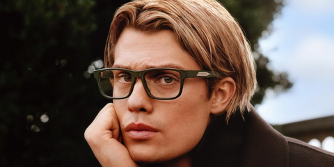Nicholas Galitzine was seen wearing green Emporio Armani EA3265U 6321 optical glasses in the Emporio Armani Fall/Winter 2025 campaign.