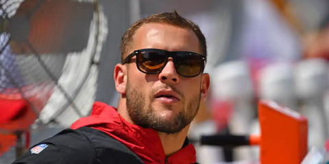 American football athlete Nick Bosa was seen wearing black and brown Ray-Ban Boyfriend RB 4147 6095/85 sunglasses with brown gradient lense. Shop online now on Pretavoir