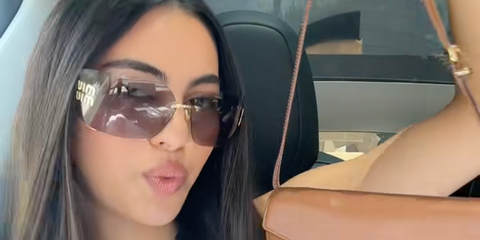 Digital creator Nicole Sahebi was seen wearing Miu Miu Rimless Runway MU 54YS 5AK06I sunglasses in her TikTok video, July 2025. Shop online now on Pretavoir