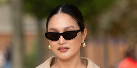 Australian designer Nicole Warne was seen wearing black Saint Laurent Sun SL 634 Nova 001 sunglasses at the Chanel Spring/Summer 2025 fashion show during Paris Fashion Week.