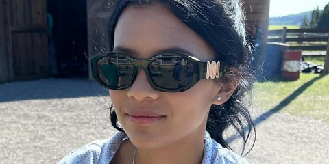 Television actress Nikki Rodriguez was seen wearing black Versace 4361 GB1/87 Medusa Biggie Sunglasses on the set of My Life with the Walter Boys