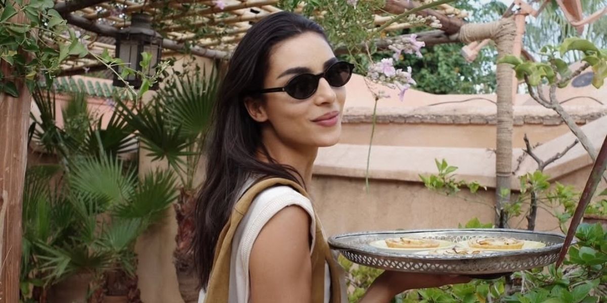 British-Moroccan model Nora Attal was seen wearing black Saint Laurent Sun SL 751 Jeanne 001 round oval sunglasses in her Instagram post