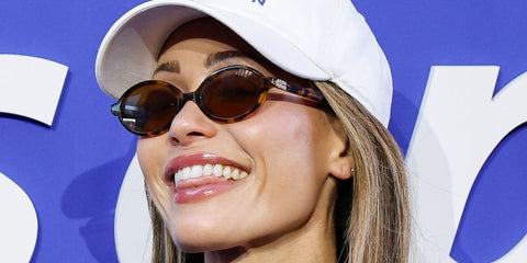 Model Olivia Amato was seen wearing tortoise Miu Miu MU 04ZS 19P2Z1  oval sunglasses at the US Open 2026