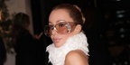 Olivia Attwood was seen wearing transparent Saint Laurent Sun SL 902 HOWL 002 pillowed sunglasses with brown lenses in London, February 2026.
