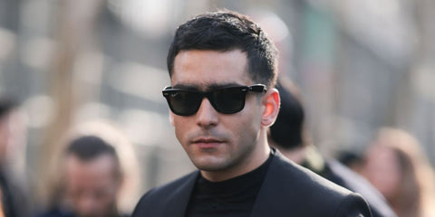 Spanish actor Omar Ayuso was seen wearing the iconic Ray-Ban Wayfarer 2140 901/58 Polarised sunglasses at the Courreges Fall/Winter 2024 fashion show during Paris Fashion Week. Shop online now on Pretavoir