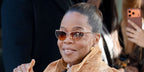 Oprah Winfrey was seen wearing gold Chloe CH0386S 004 Uma cat eye sunglasses with brown to orange gradient lenses at the Chloe Fall/Winter 2026 fashion show during Paris Fashion Week.