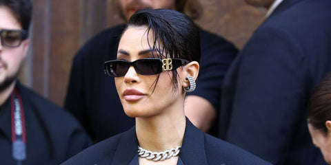 Moroccan singer Oumaima Taleb was seen wearing black Balenciaga BB0096S 001 rectangular sunglasses at the Balenciaga Haute Couture Fall/Winter 2025 fashion show during Paris Couture Week