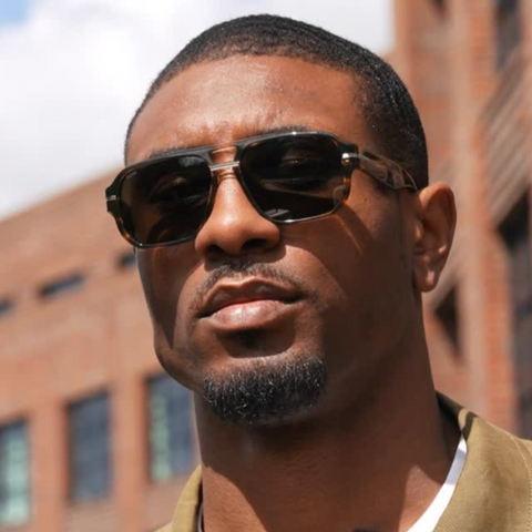 Former professional basketball player Ovie Soko was seen wearing Hugo Boss 1718/S 09Q2K sunglasses in a BOSS fragrance social media ads, May 2025.