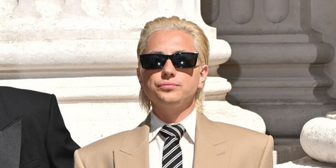 Argentine singer Paco Amoroso was seen wearing black and gold Saint Laurent SL 766 001 sunglasses at the Saint Laurent Menswear Spring/Summer 2026 fashion show during Paris Men's Fashion Week.