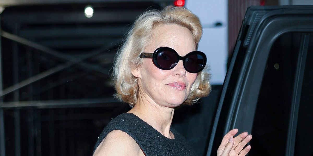 Pamela Anderson was seen wearing black Garrett Leight Mr. Leight Portia S ML2053 BK-GM/BLUOPL Limited Edition oval sunglasses with blue lenses in New York City, May 2025. Shop online now on Pretavoir