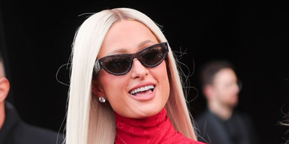 Paris Hilton was seen wearing monogrammed transparent grey Gucci GG1834S 016 sunglasses at the Gucci Fall/Winter 2026 show during Milan Fashion Week.