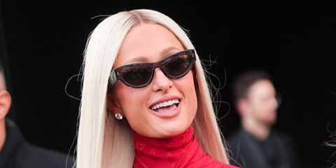 Paris Hilton was seen wearing monogrammed transparent grey Gucci GG1834S 016 sunglasses at the Gucci Fall/Winter 2026 show during Milan Fashion Week.