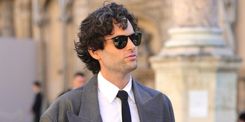 Gossip Girl and You actor Penn Badgley was seen wearing black Ray-Ban Erika RB 4171 601/2P round sunglasses with green Polarised lenses to attend the Valentino Spring/Summer 2024 fashion show during Paris Fashion Week