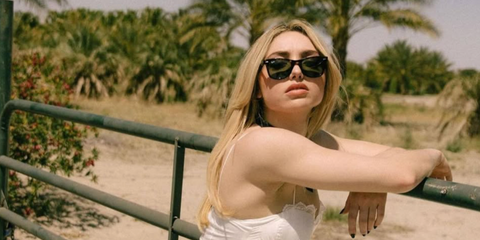 Peyton List was seen wearing tortoiseshell Ray-Ban New Wayfarer RB 2132 902 sunglasses with green lenses in a photo shoot