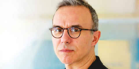 French novelist Philippe Besson was seen wearing Oliver Peoples Riley-R OV5004 1795 optical glasses in dark mahogany. Shop online now on Pretavoir