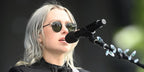 Singer-songwriter Phoebe Bridgers was seen wearing black Garrett Leight Wilson 4003 BK-PW/SFPG15 round sunglasses with green lenses in London. Shop online now on Pretavoir