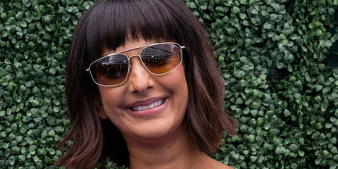 Actress Poorna Jagannathan was seen wearing gold Oliver Peoples R-14 OV1361S 5245/13 sunglasses with brown gradient lenses at the Film Independent Spirit Awards 2026.