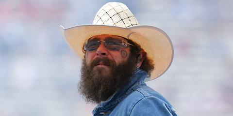 Post Malone was seen wearing Miu Miu MU A51S 5AK50K rimless sunglasses with light grey lenses at FIFA World Cup 2026 Final Halftime Show