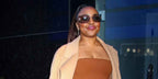 Quinta Brunson was seen wearing gold Miu Miu Rimless Runway MU 54YS 5AK06I rimless sunglasses with purple lenses outside "Good Morning America" in New York City, February 2024