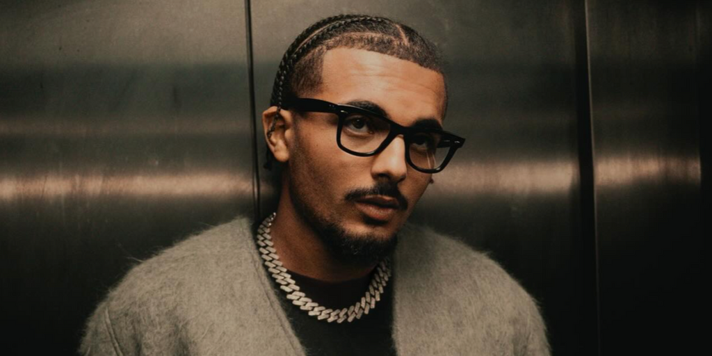 French rapper RK (Ryad Kartoum) was seen wearing black Ray-Ban Wayfarer ...