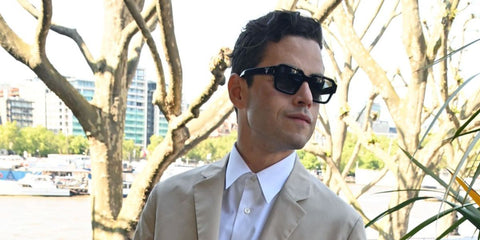 Rami Malek was seen wearing Prada PR 02ZS 1AB06T square sunglasses at the 'Dexter Fletcher In Conversation' celebrating Fletcher's 50 years in show business in London