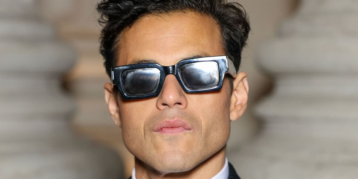 Rami Malek was seen wearing black Saint Laurent SL 572 001 sunglasses at the Saint Laurent Menswear Fall/Winter 2026 fashion show during Paris Men's Fashion Week.