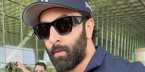 Bollywood actor Ranbir Kapoor was seen wearing black Prada PR 10ZS 1AB5S0 sunglasses at Mumbai Airport.